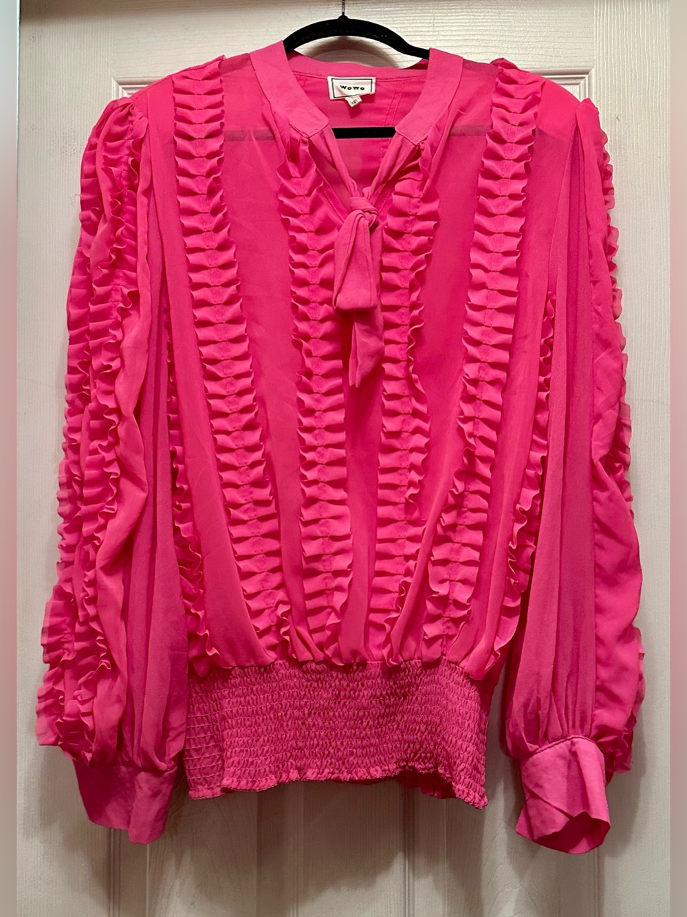 hot pink sheer ruffle blouse by the brand WoWo. Woven Heart Ruffled Tie-Neck Blo